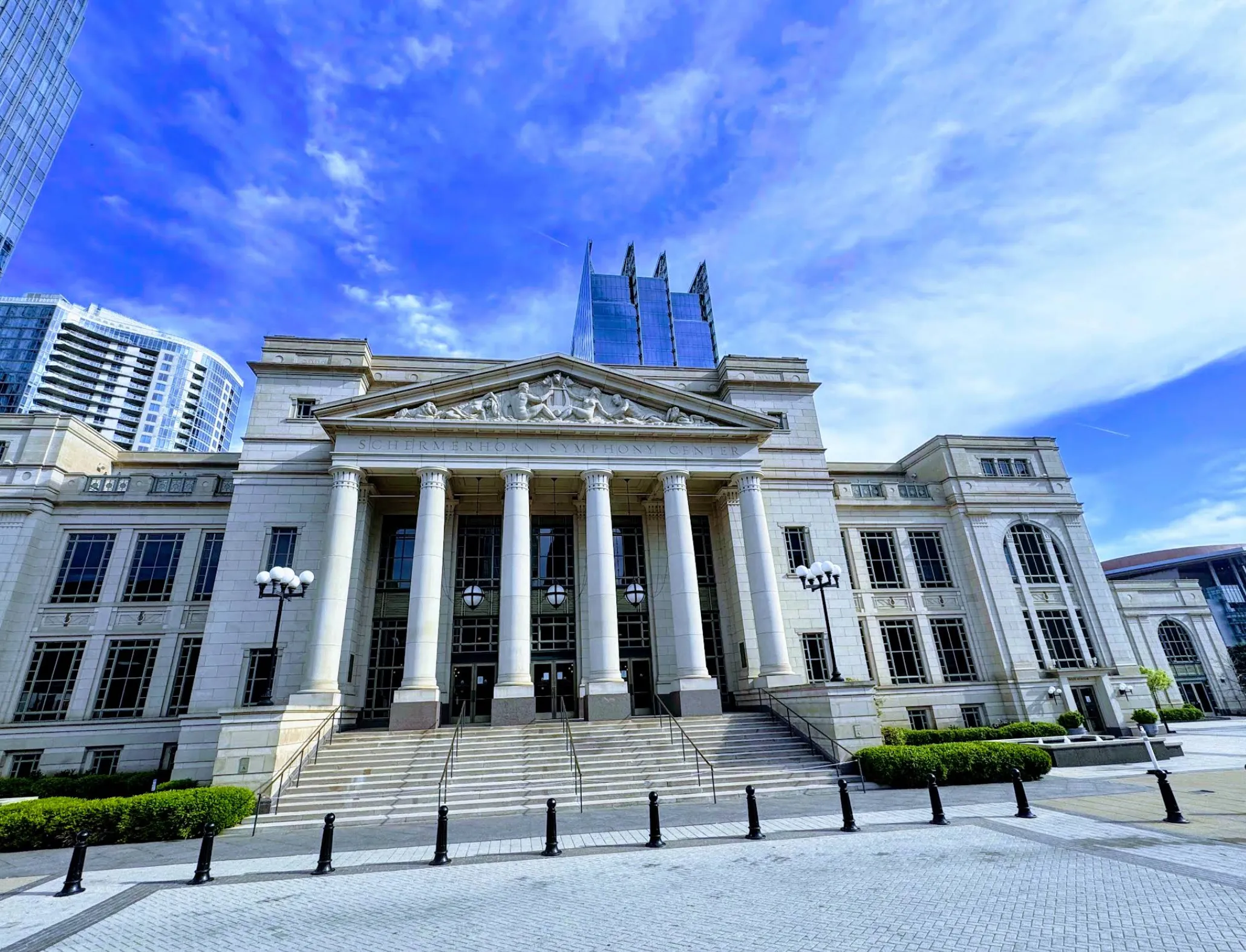 Image: Inside view of a symphony hall with a family taking their seats before the performance