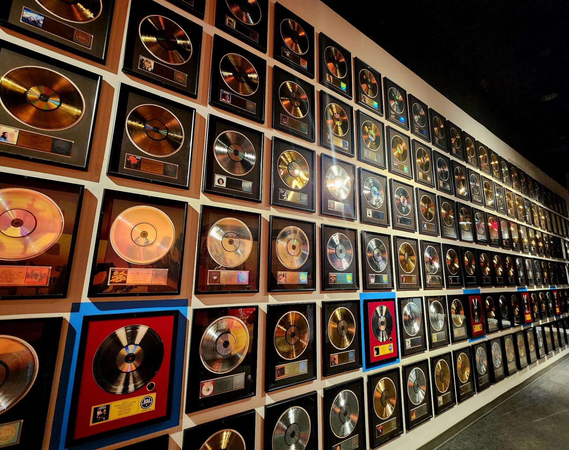 Image: Children looking at a glass display case of guitars inside the Country Music Hall of Fame